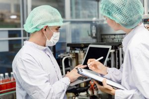 Quality control and food safety team inspection the product standard in the food and drink factory